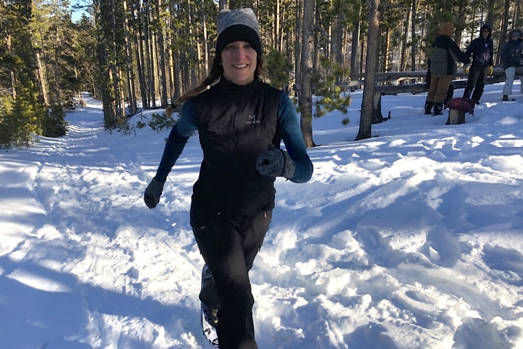 Penney snowshoe running in the forest of Colorado