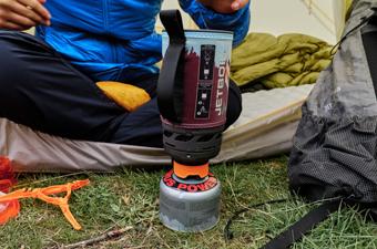 A close up of the Jetboil Flash 1.0 backpacking stove outside of a tent